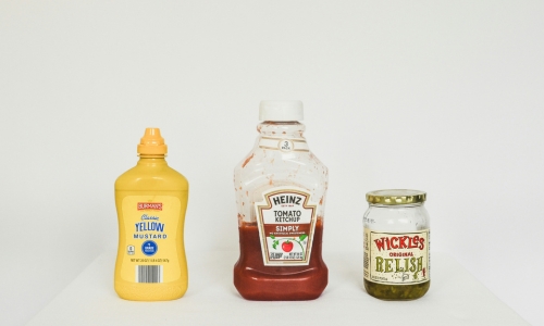 Most condiments are not recommended for dogs because they contain high levels of salt, sugar, fat, or toxic ingredients like garlic and onions. 