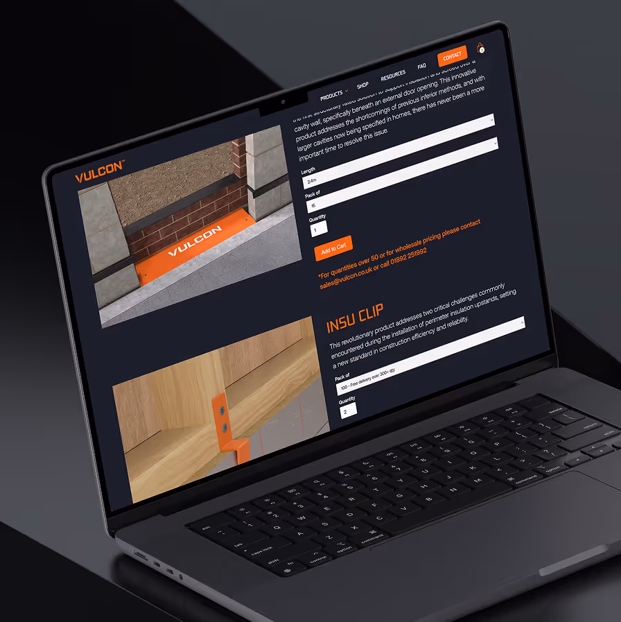 Laptop screen showing Vulcon products website with insulation clips and door cavity wall support images.