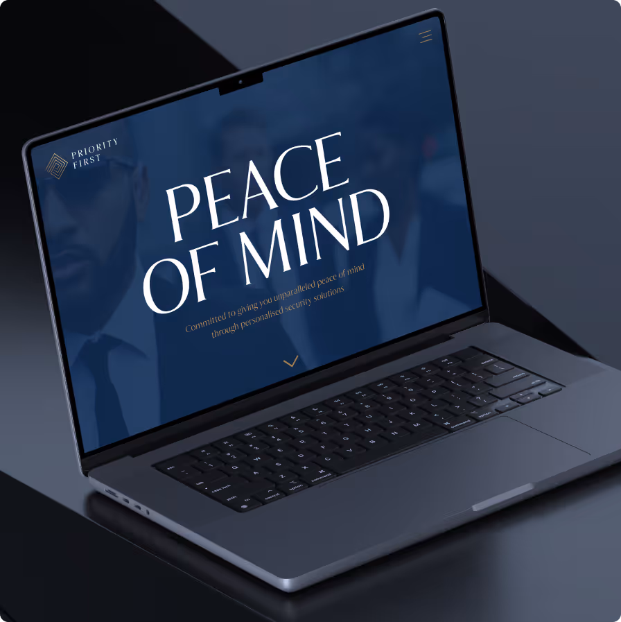 Open laptop with screen text saying 'Peace of Mind' and security service message on dark background.