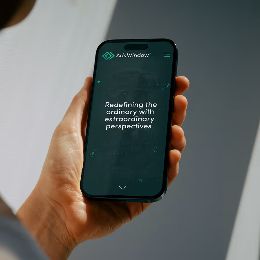 Hand holding a phone displaying Ads Window with text redefining ordinary with extraordinary perspectives.