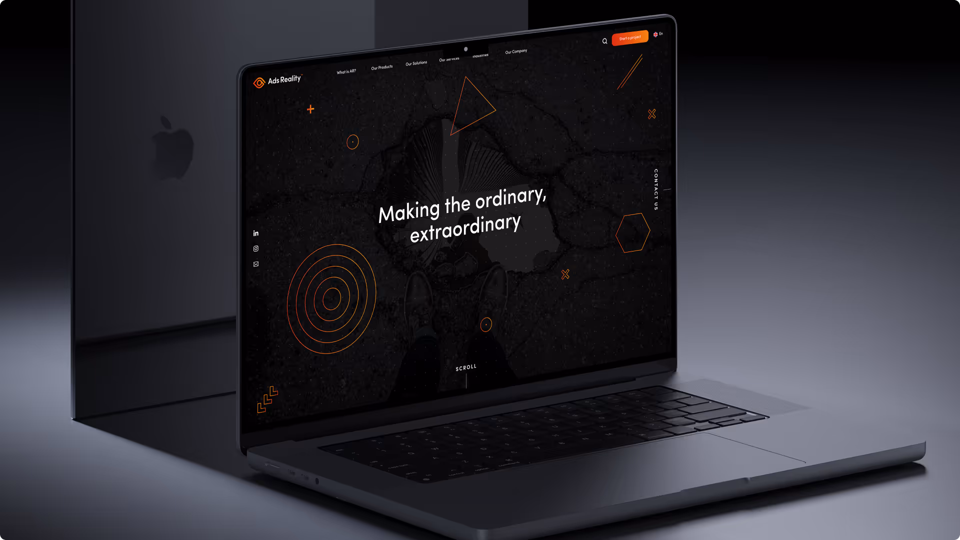 MacBook laptop displaying Ads Reality website with text: Making the ordinary, extraordinary.