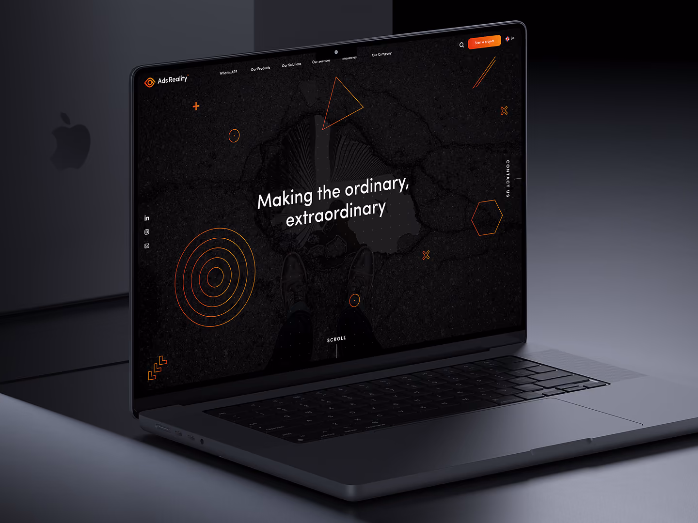 Open laptop displaying a website homepage with text: Making the ordinary, extraordinary.