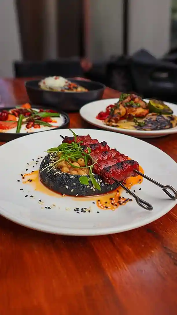 A taste of Ember right here 🔥 

Smoky grilled chorizo Chistorra style • hummus negro • toasted sesame • fresh coriander 

Head to the link in our bio to try for yourself.