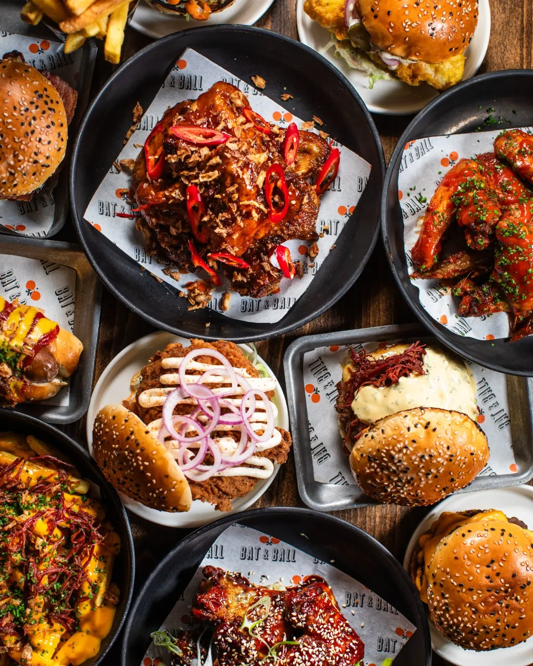 Have you heard? We've updated our menu! 🤩 

The classics remain, but with new banging editions like the:

Dub be good to me 🍗 
A jerk-spiced chicken burger with grilled pineapple, garlic mayo and lettuce, all served in a fluffy seeded bun.

Or the...
Bat & Ball Big Serve 🏓 
The perfect platter to share, loaded with chicken strips, a cheeseburger slider, corn ribs, Korean chicken wings, halloumi fries, Padron peppers, curly fries and loads of sauces. 

Head to the link in our bio to check out the new menu 🍽️