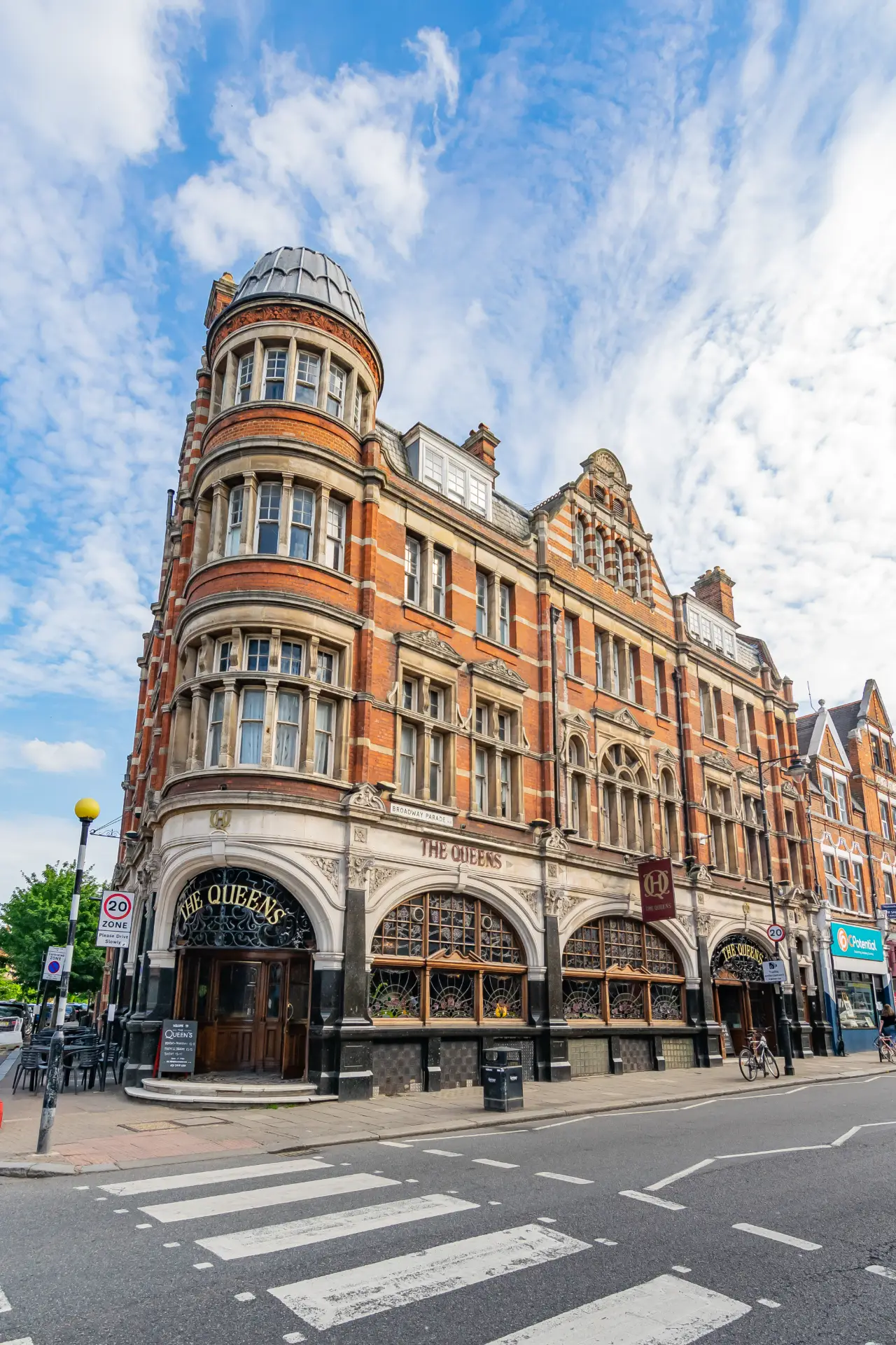 Nestled in the heart of Crouch End, The Queens is a Grade II* listed Victorian gem that has long been a social hub for the community. This iconic building, with its stunning nouveau stained glass, intricate plasterwork, and rich dark wood paneling, exudes timeless charm and character. The Queens offers a warm welcome to locals, regulars, and newcomers alike. Whether you’re stopping by for a drink, a meal, or simply to soak in the historic atmosphere, The Queens is a true landmark in the vibrant urban village of Crouch End.