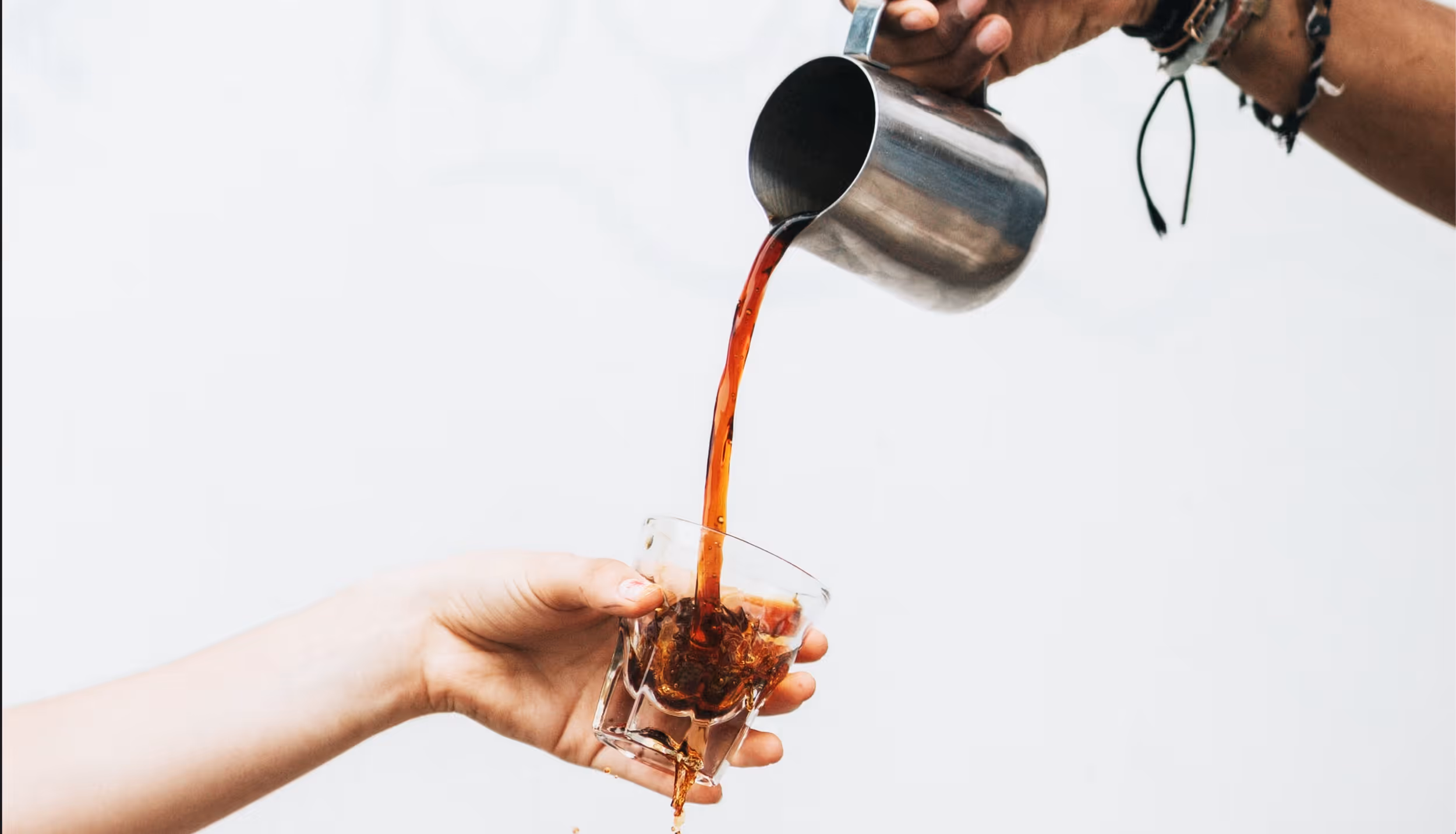 Man in suit sites on chair with red background