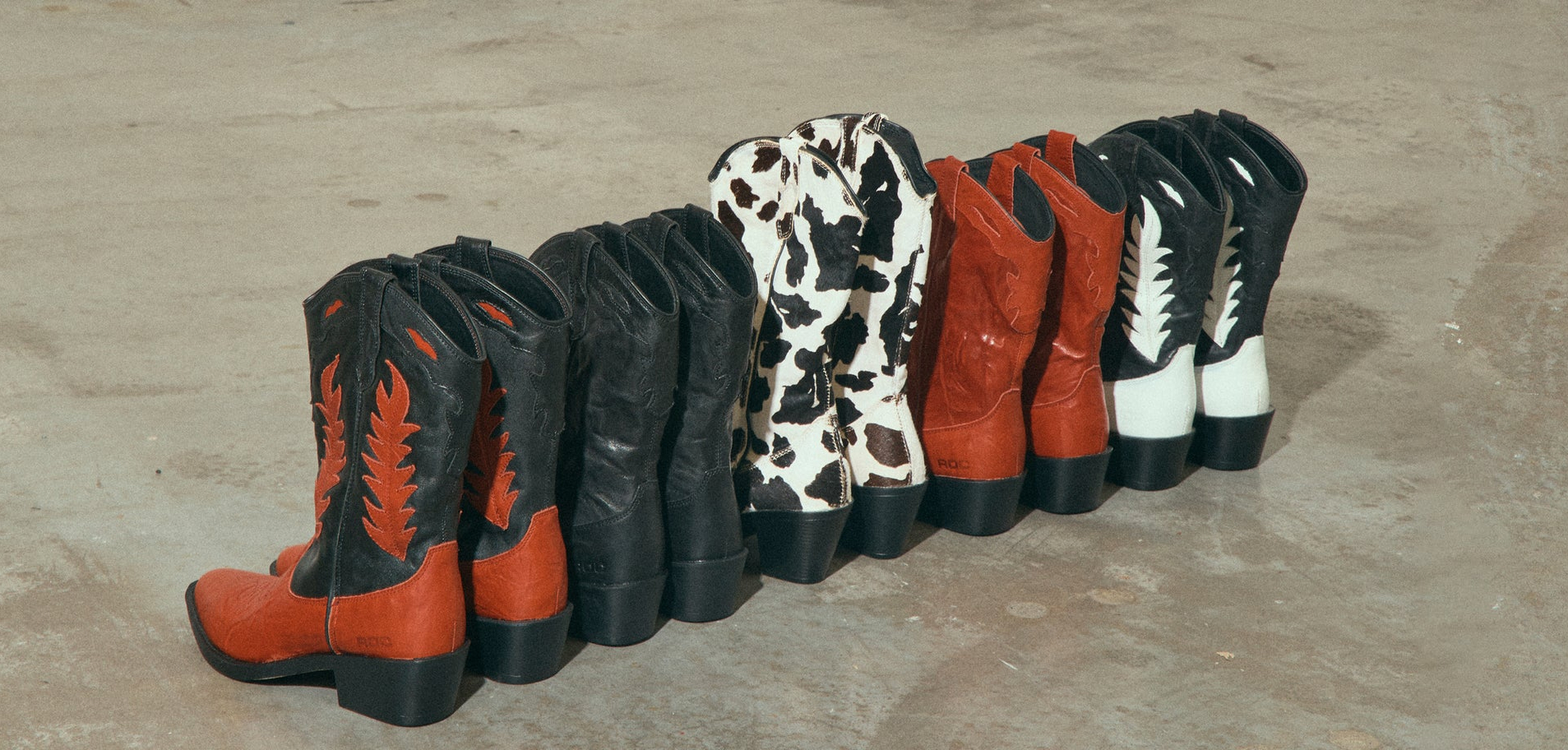 ROC Boots product range styled photography for dual-brand ecommerce store