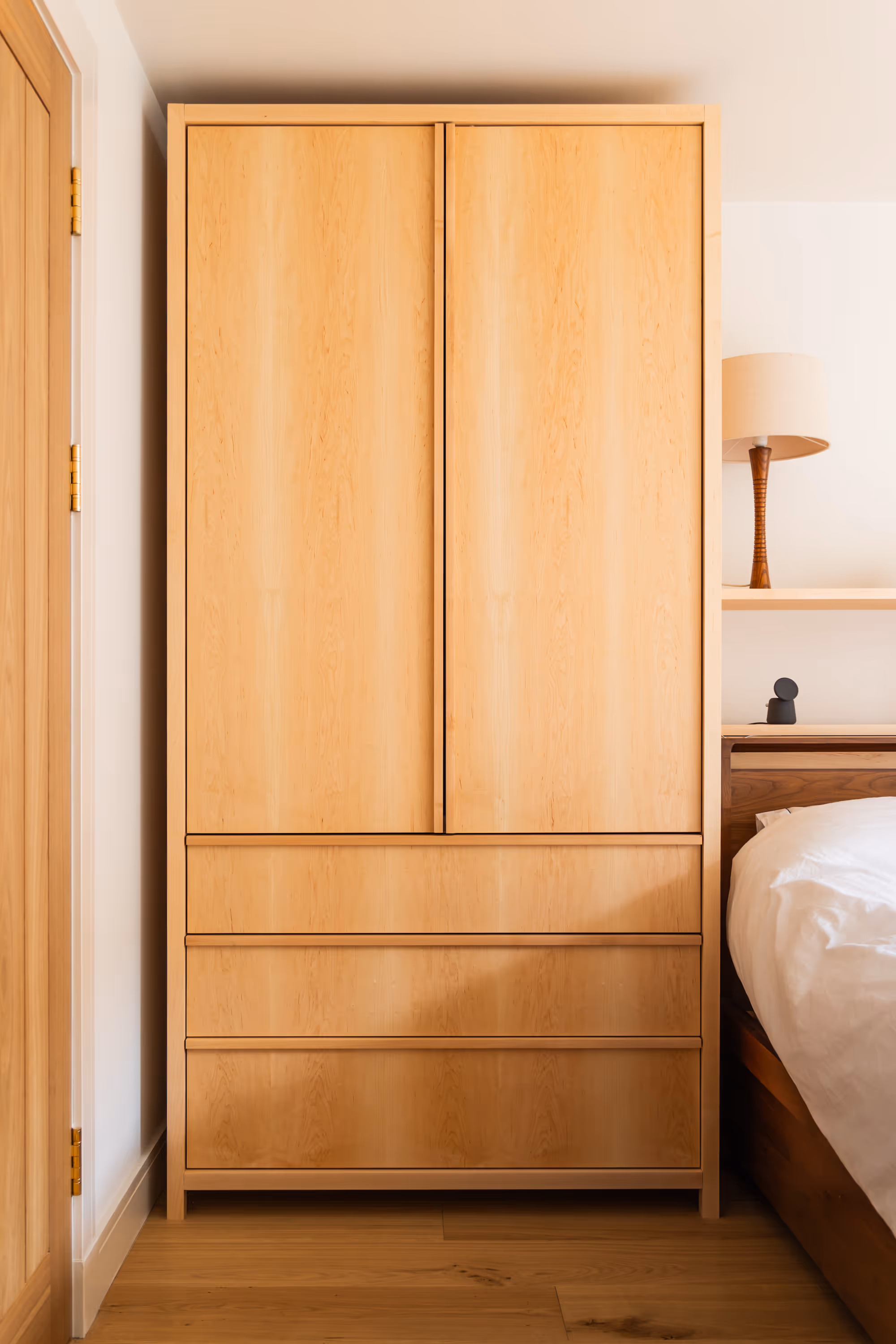 Wardrobe storage in a bedroom, designed and built by Bruntsfield Designs