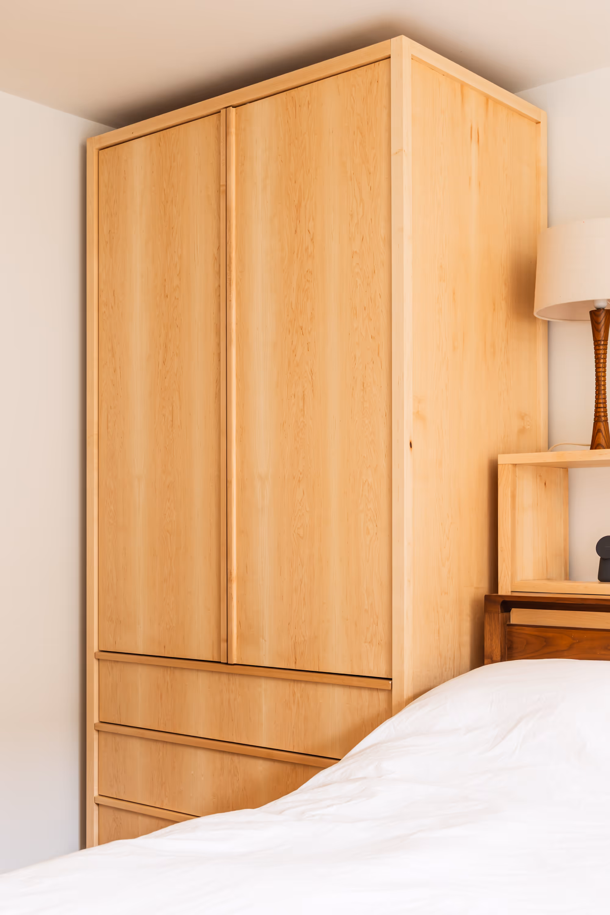 Wardrobe storage in a bedroom, designed and built by Bruntsfield Designs