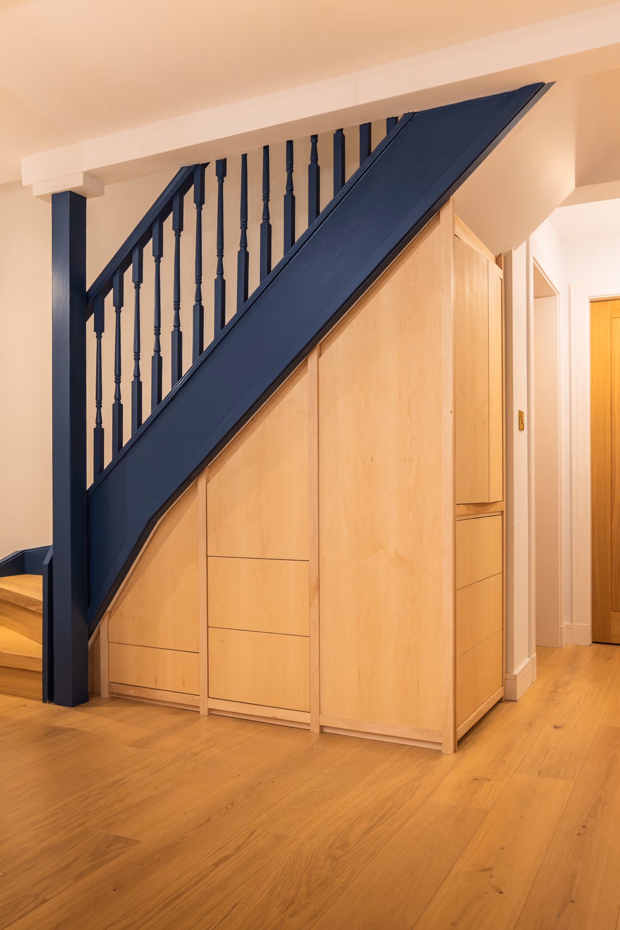 Bespoke under-stair storage by Bruntsfield Designs