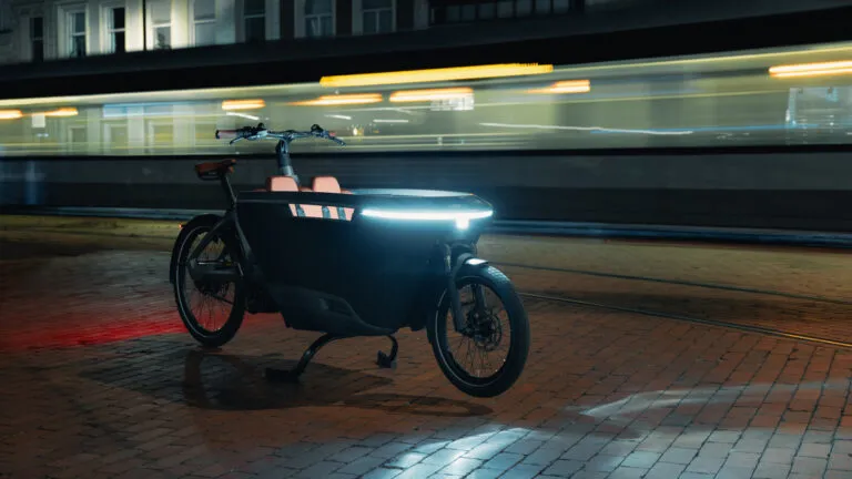 Blurred green surface with horizontal lines and a light gradient background.