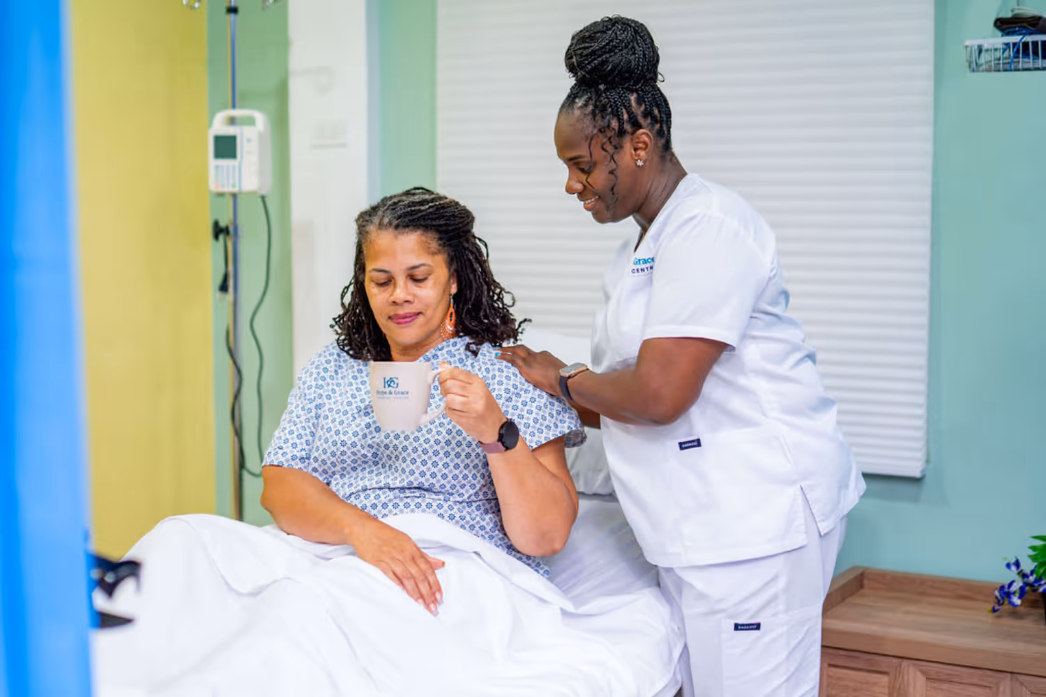 nurse caring for elderly woman at Hope & Grace Cardiac Centre