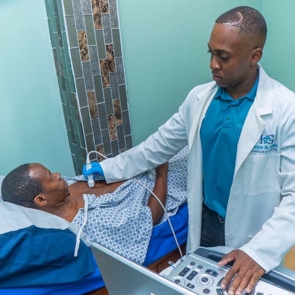 Doctor performing an echocardiogram on a patient lying on a hospital bed.