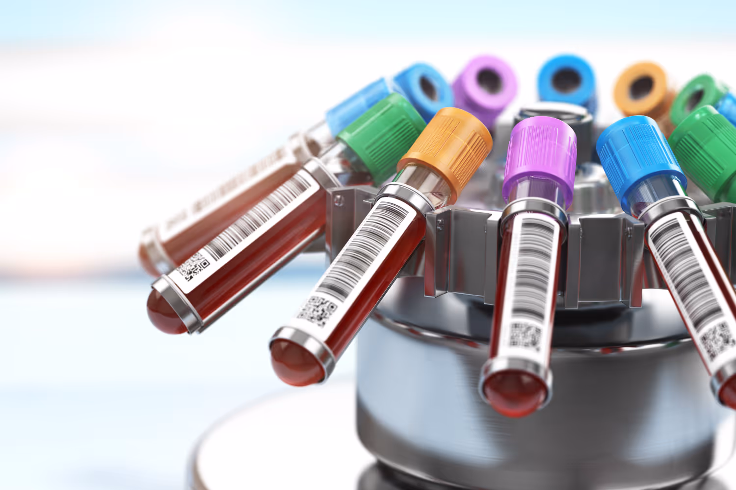 Blood sample tubes with colored caps and barcodes held in a metal centrifuge rotor.
