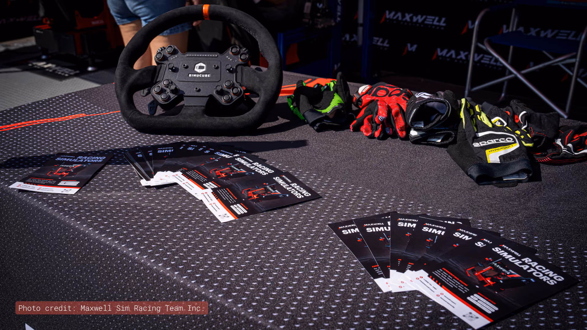 Racing wheel, gloves and Maxwell brochures