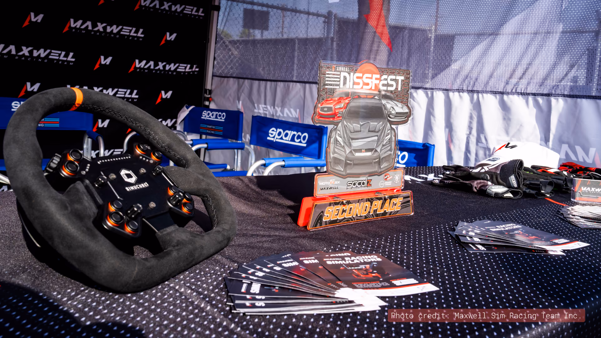 Maxwell event display with steering wheel and brochures