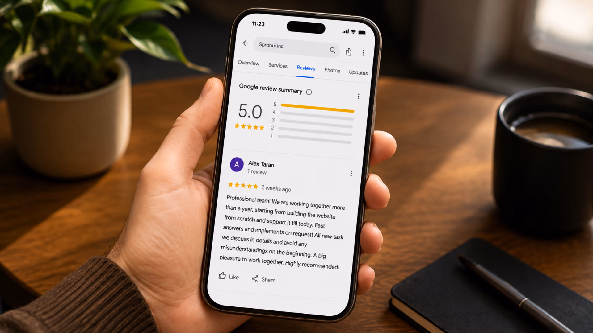 Smartphone showing a five-star WowTrip Google review