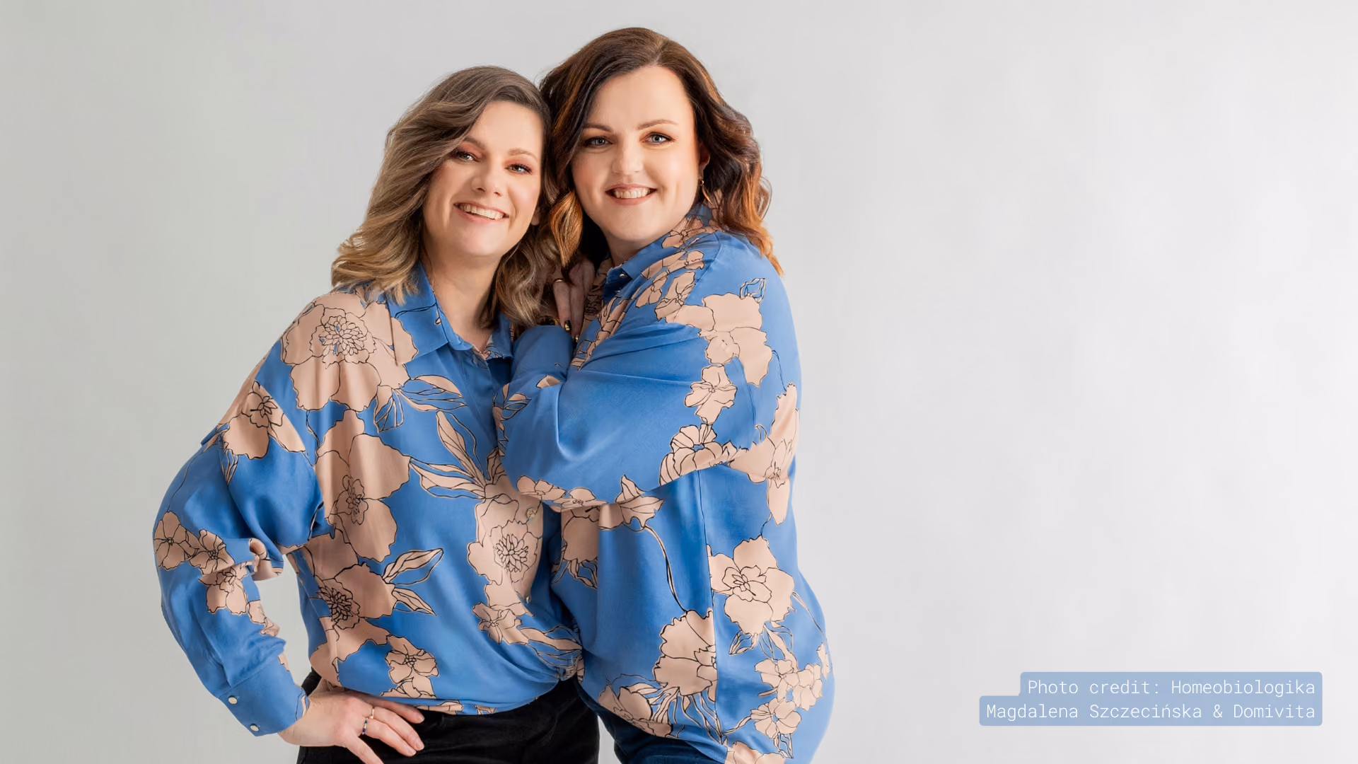 Two wellness experts in matching blue floral tops