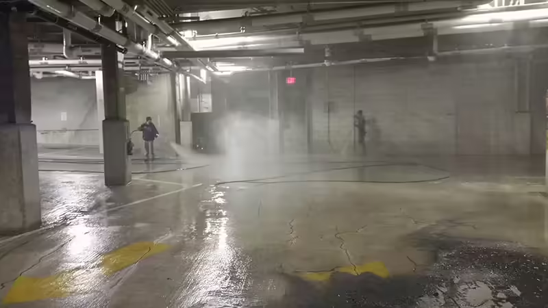 Professional pressure washing of parking structure floors and concrete surfaces
