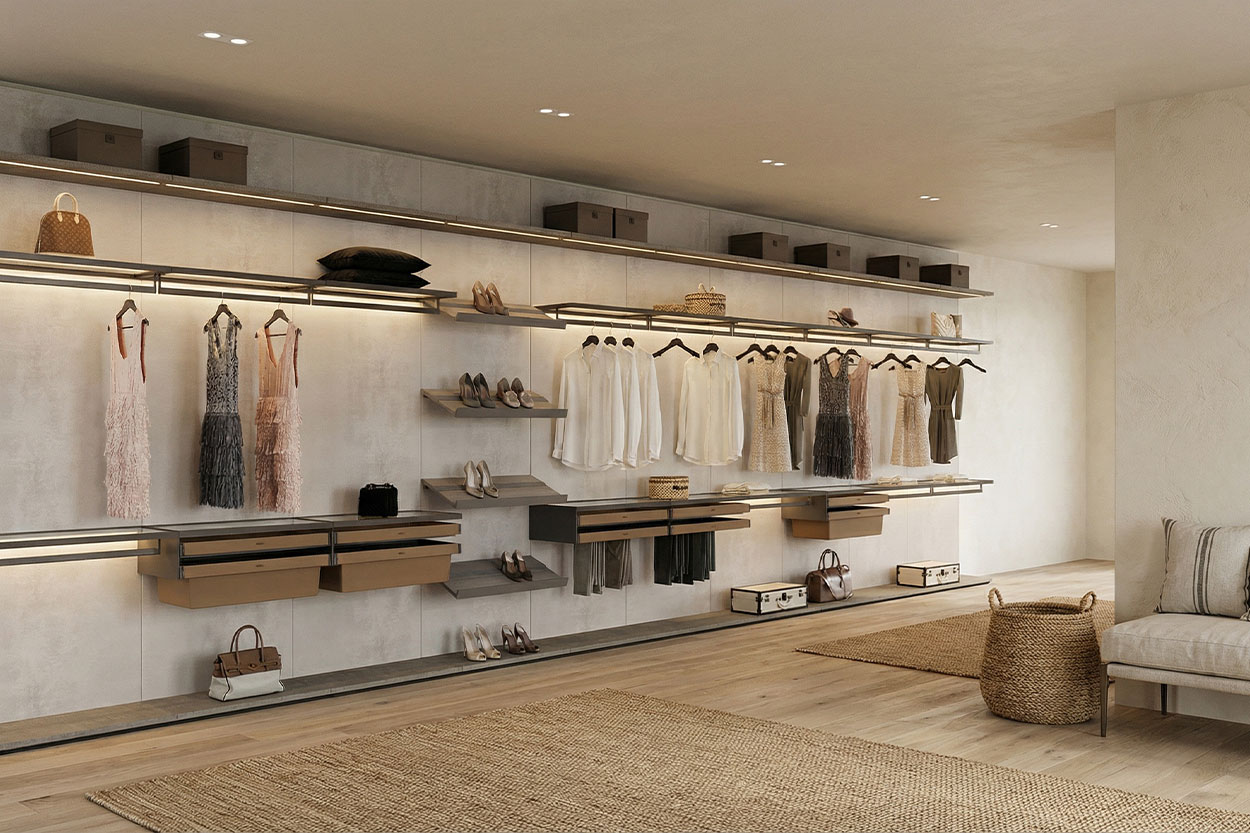 Luxury wall-mounted closet system with integrated LED lighting and wood wall panels in a Nantucket dressing suite.