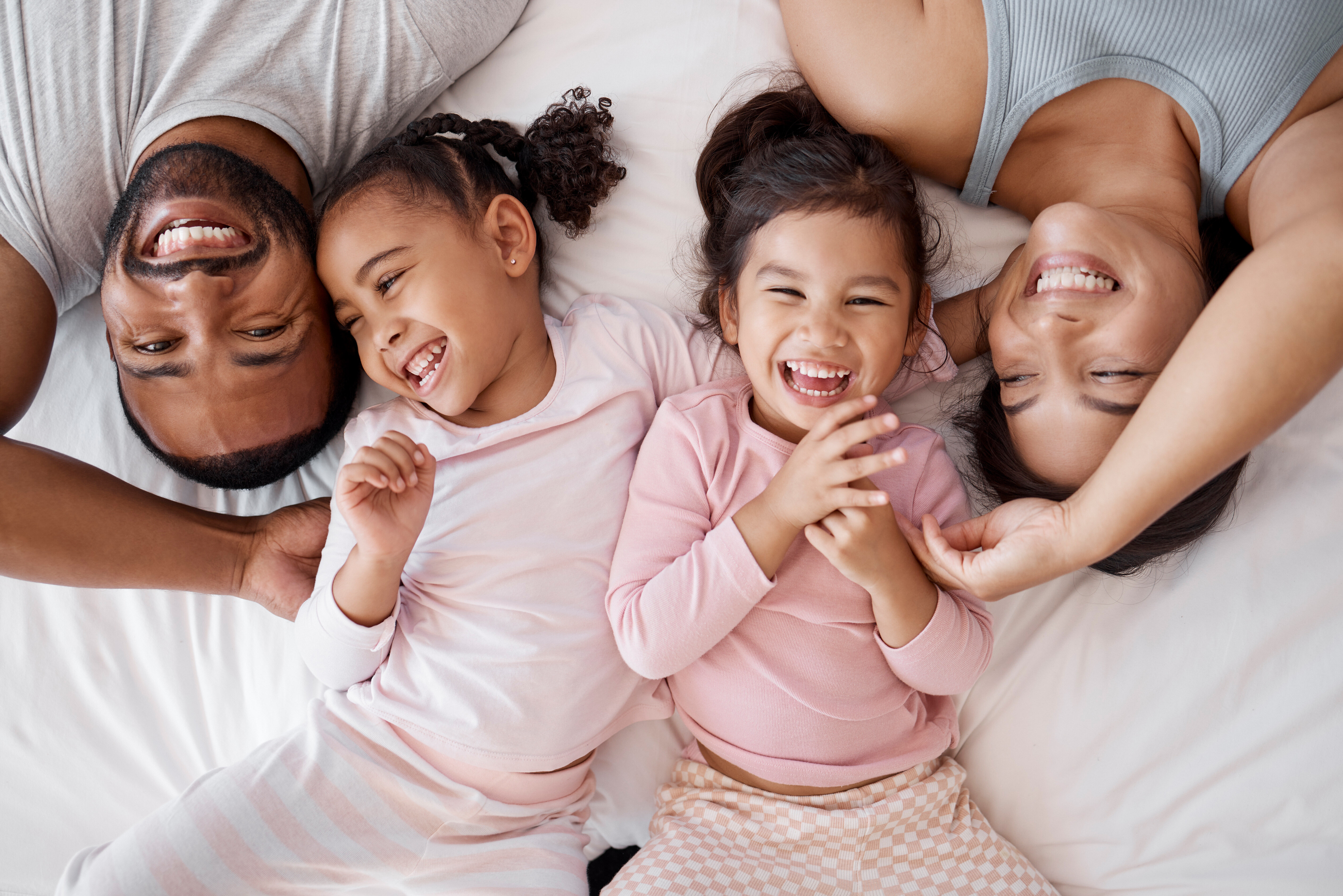 family laying down stock image