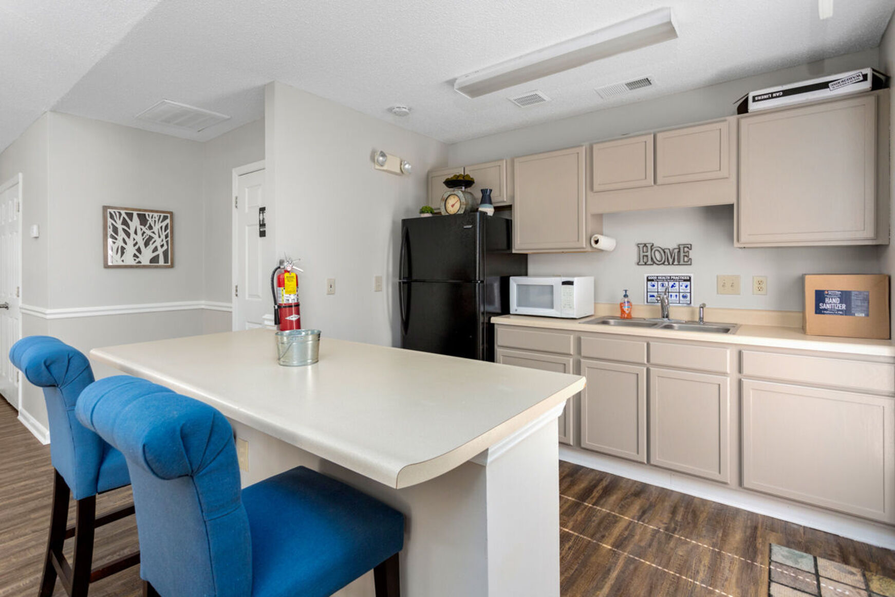 Kitchen in clubhouse with blue chairs