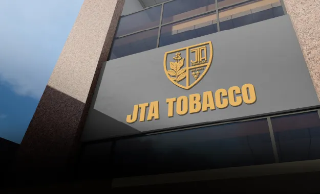 A building with a sign that reads jta tobacco.