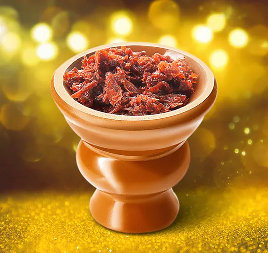 A bowl of dried food sitting on top of a table.