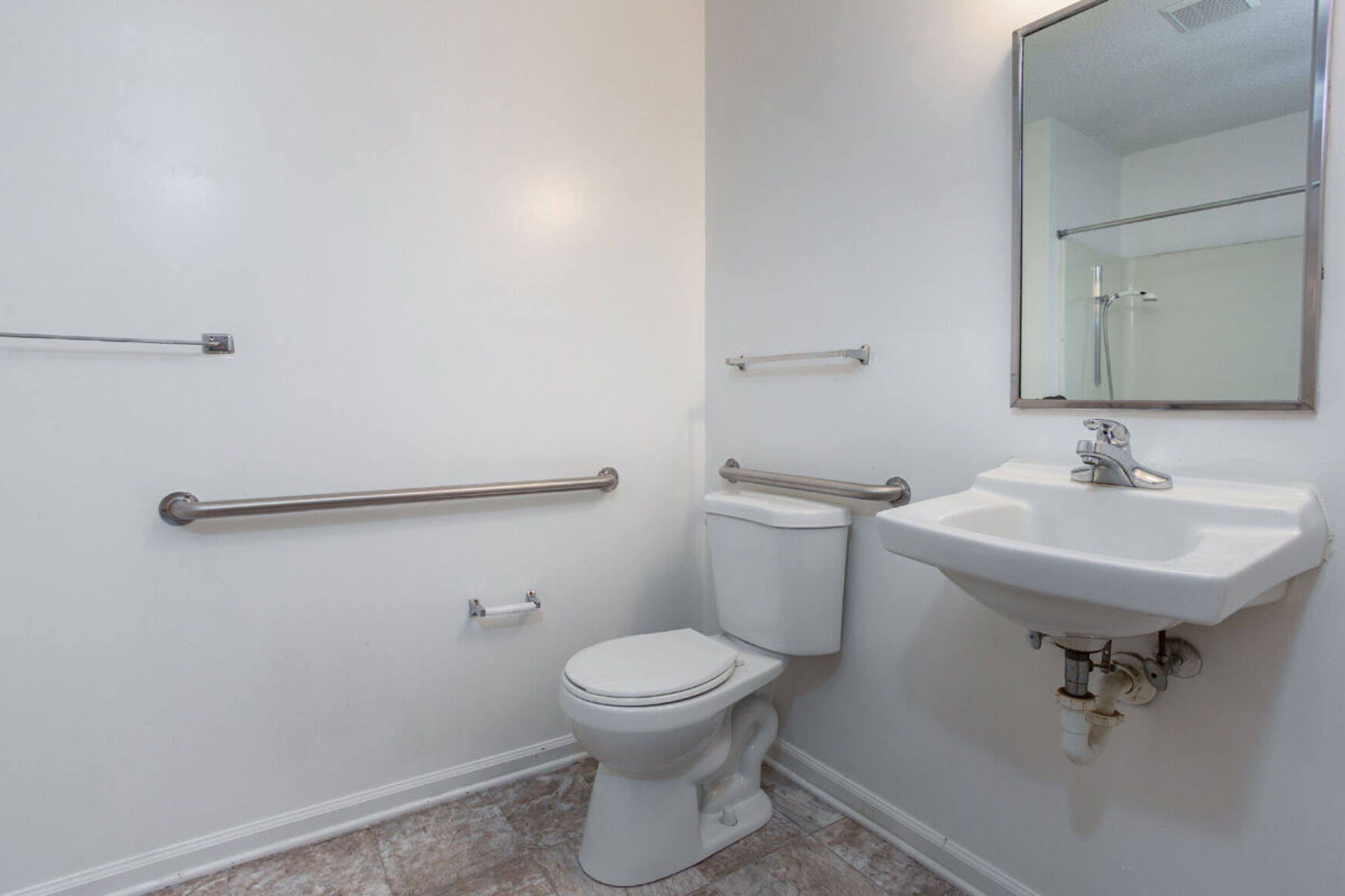 Bathroom with floating sinks and toilet