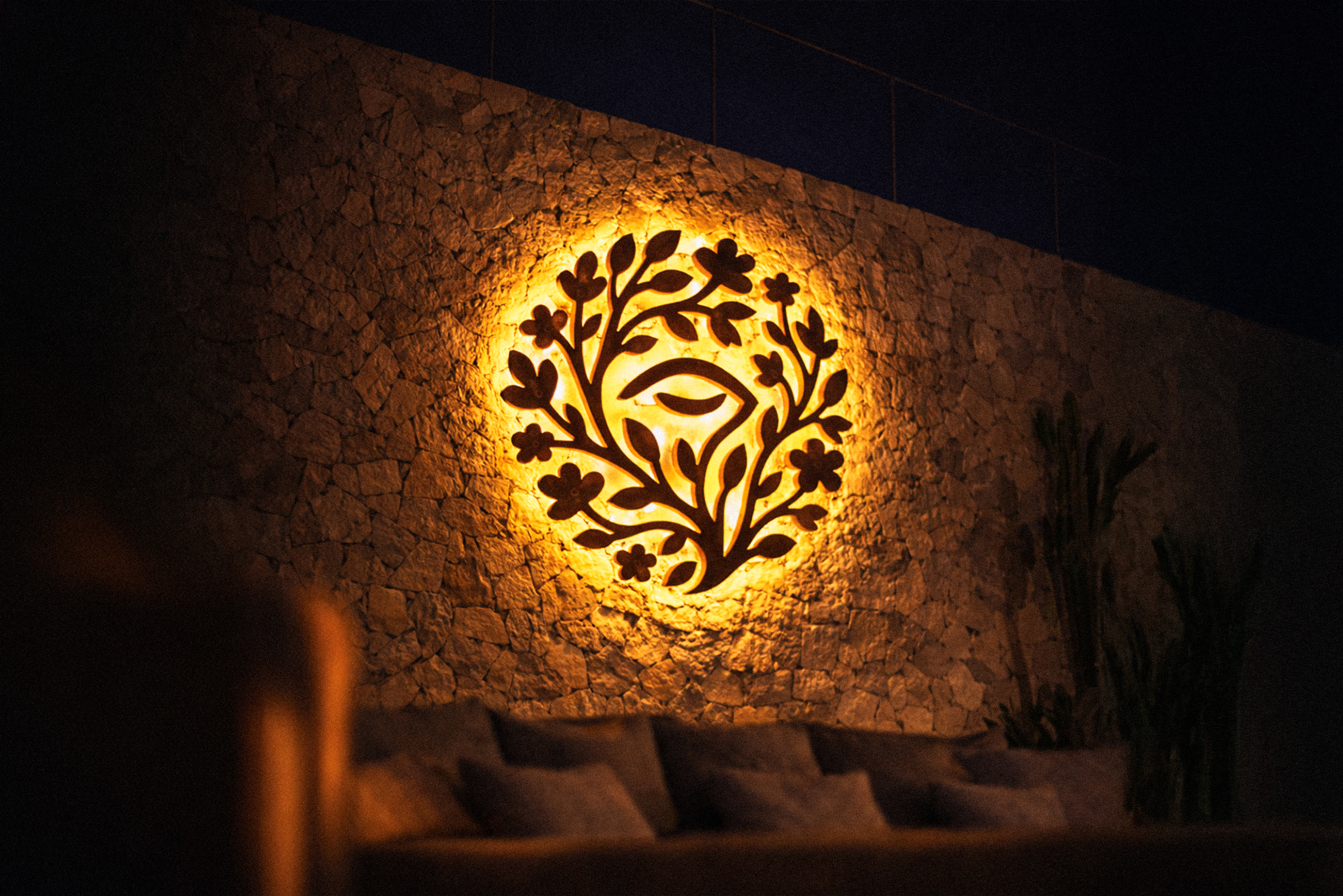 Reverie wellness brand identity illuminated logo sign on interior wall