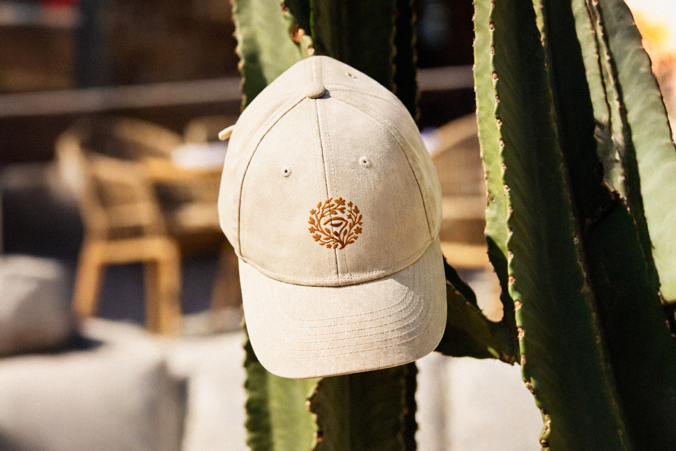 Reverie wellness brand identity logo embroidered on beige cap