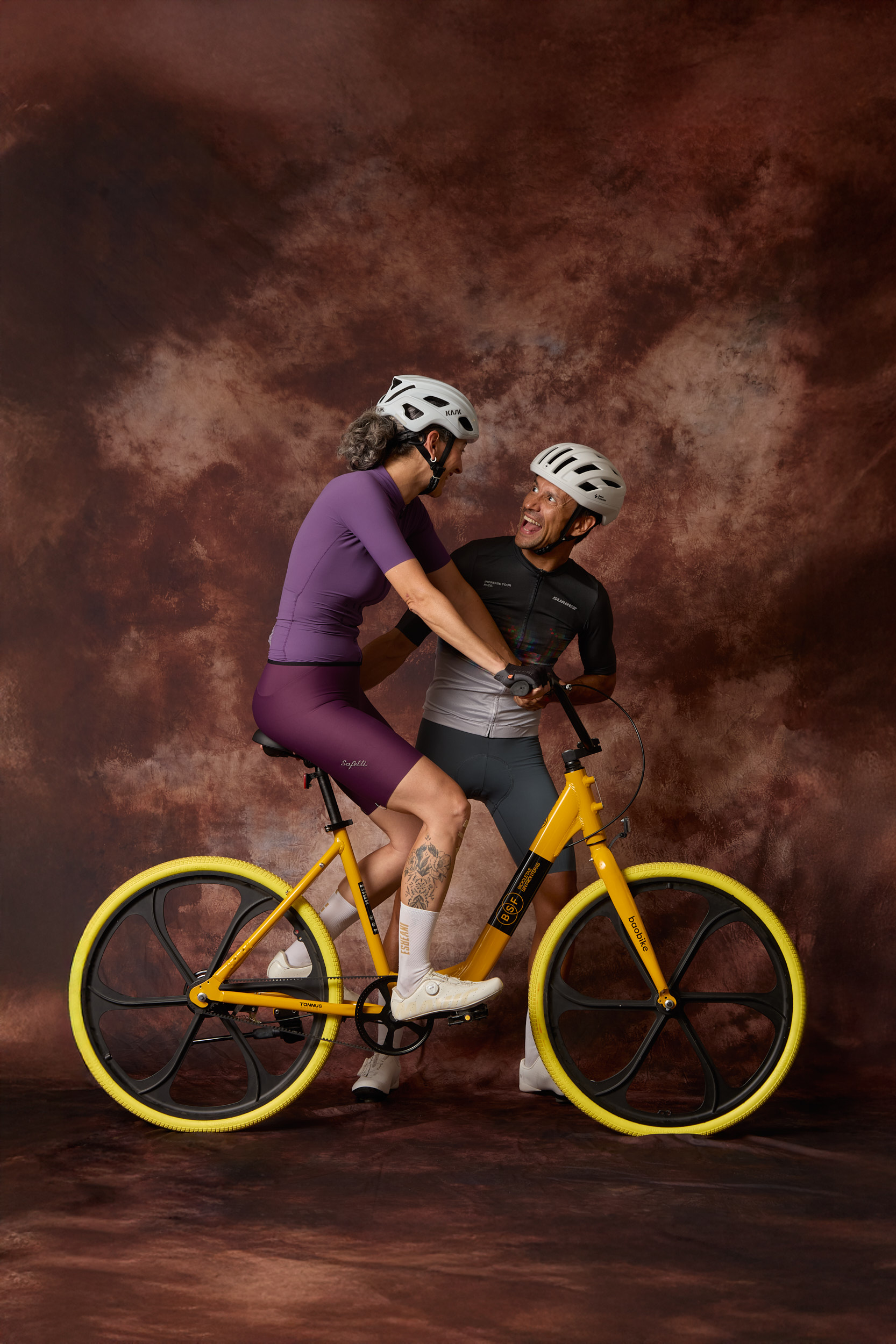 Student standing with yellow Baobike bicycle on rural road in Senegal