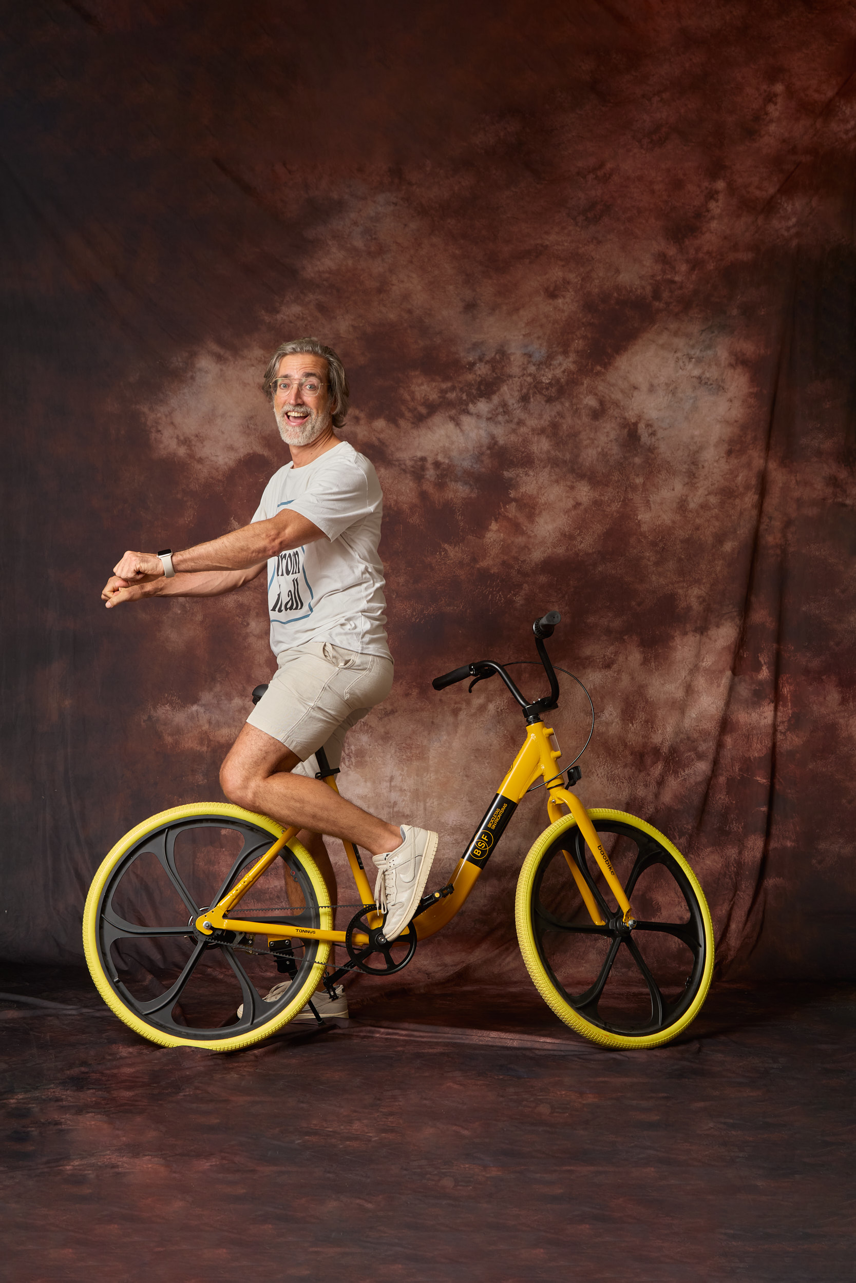 Cyclists Without Borders Baobike portrait with yellow bicycle and studio background