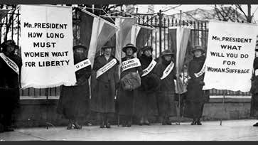 Suffragists picketing the White House with banners and college sashes