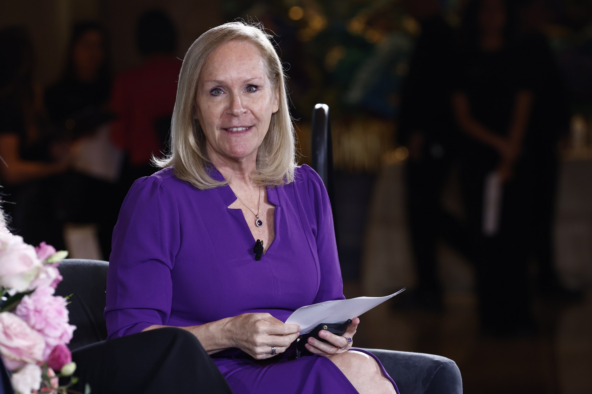 Cindy Goff of ACLI seated on stage moderating a Summit panel