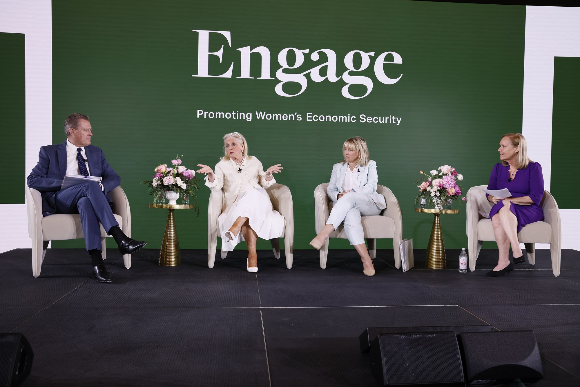 Four panelists seated on the Engage Summit stage for the politics of labor discussion