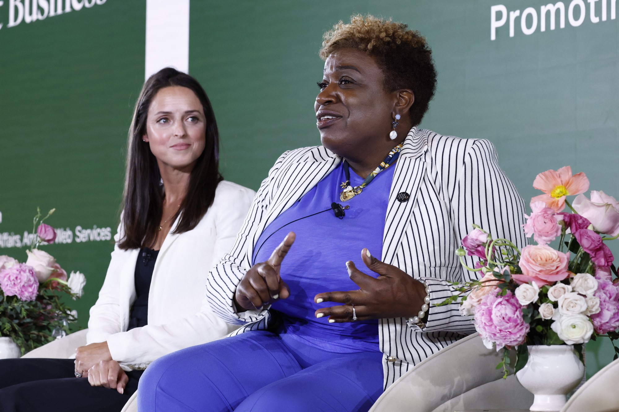 Emily Morris and Shirley Boubert-Rumble seated on stage at the Engage Summit
