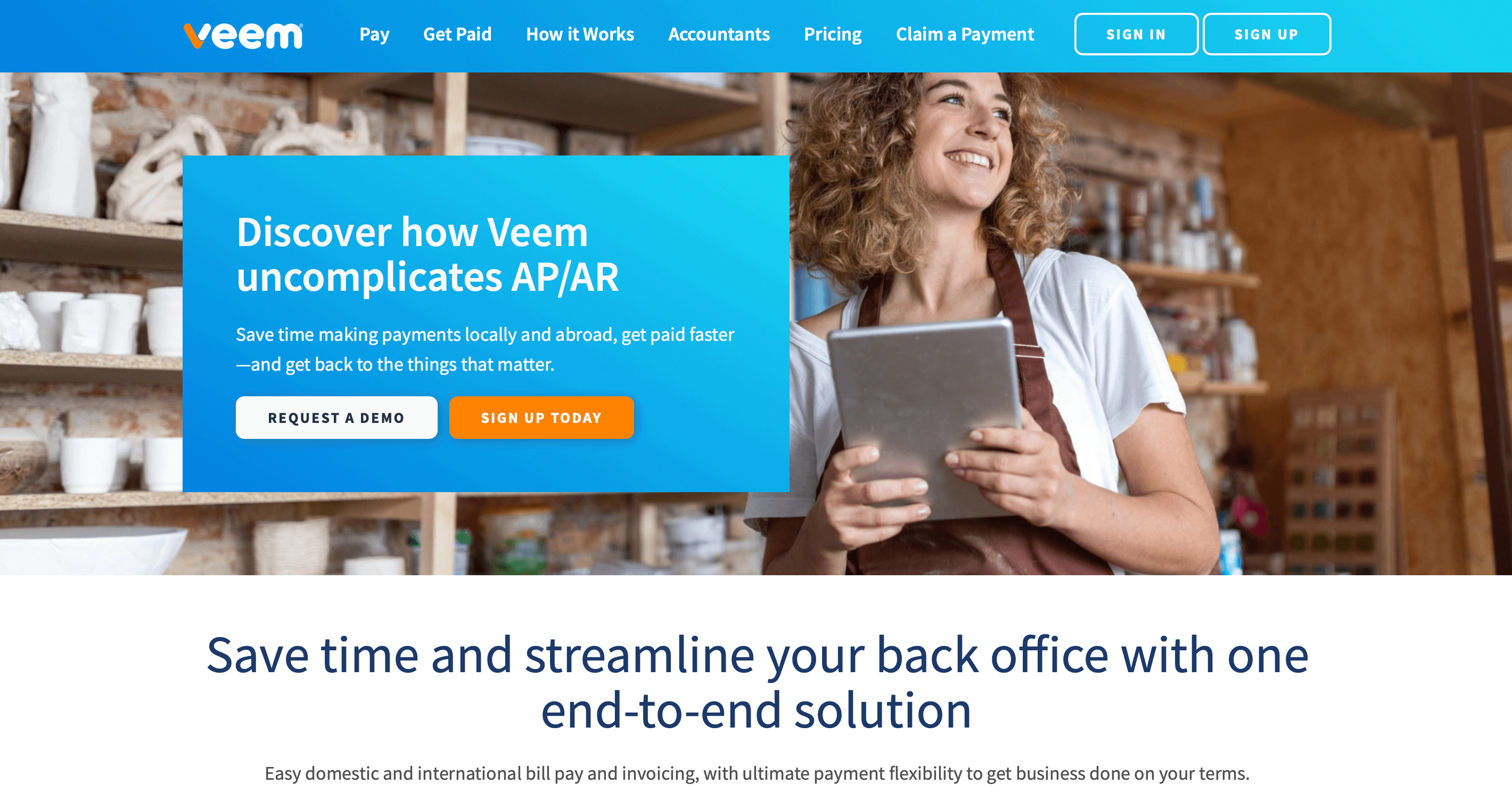 Veem homepage showing a smiling woman in an apron holding a tablet with AP/AR payment solution tagline