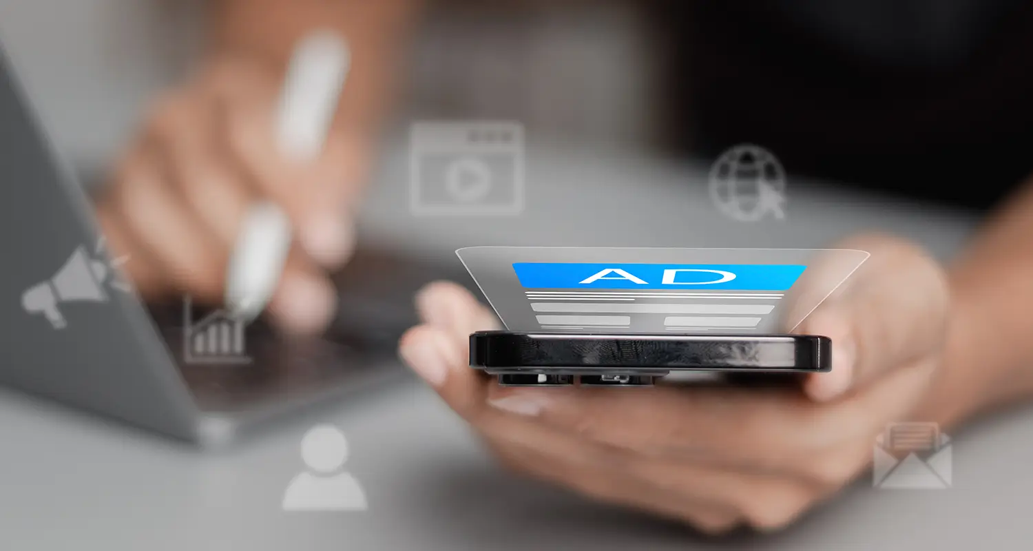 Person holds a smartphone displaying a digital ad with floating marketing channel icons around it