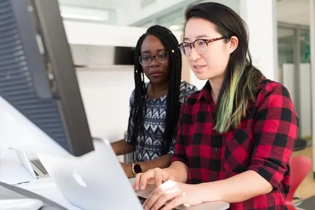 Two people working in an office