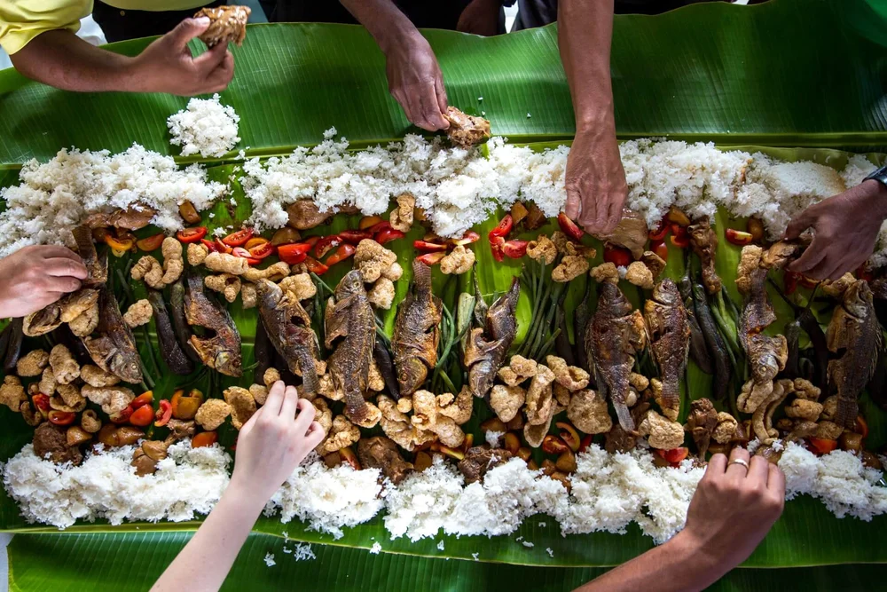 Seafood and rice laid out in a kamayan feast or boodle fight