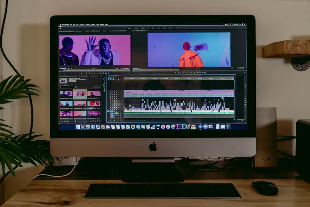 An iMac showing a video editing software