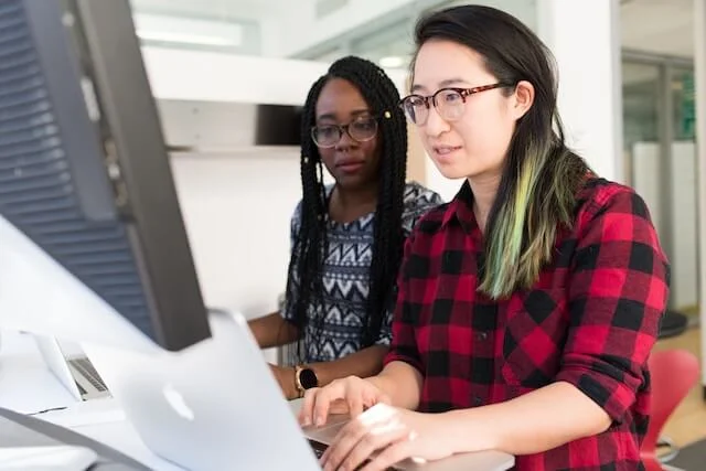 Two people working in an office