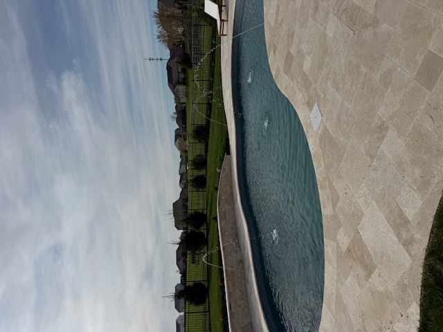Inground pool with deck jets in Deerfield Township, Ohio
