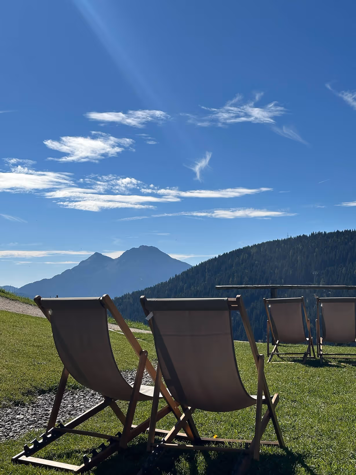 Two chairs looking out over mountains in the distance