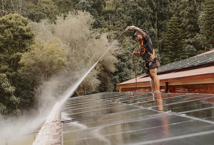 Roof and solar panel cleaning using high-pressure water system