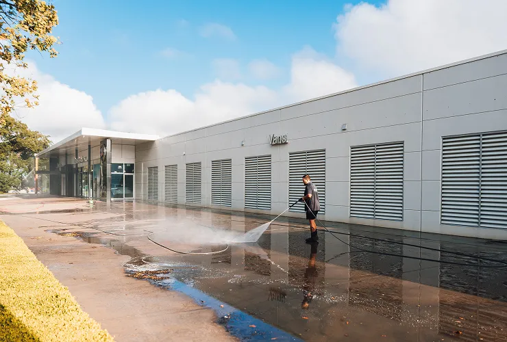 Commercial pressure cleaning of building exterior and concrete surfaces