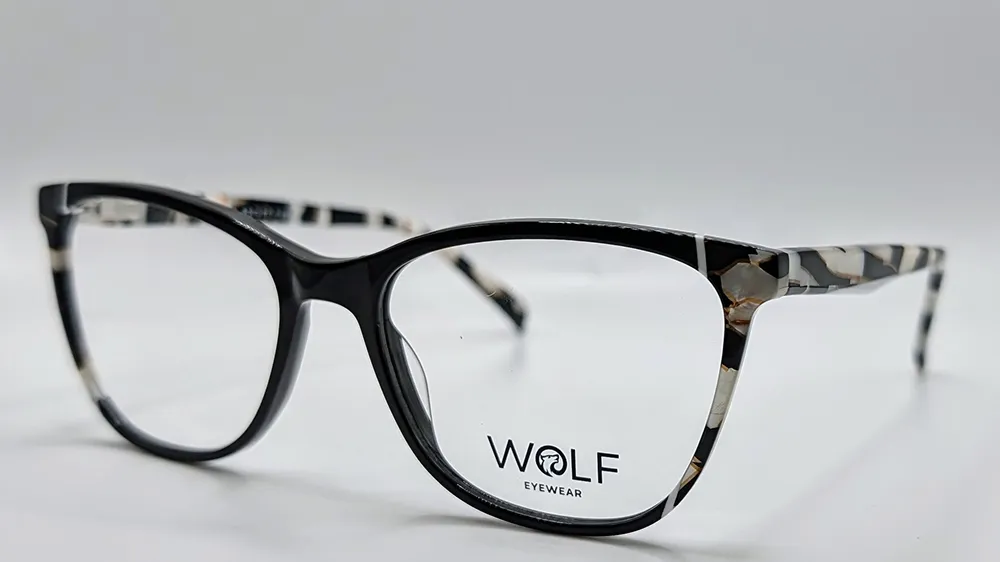 Wolf Eyewear glasses with black frames and patterned black-and-white marbled temples.