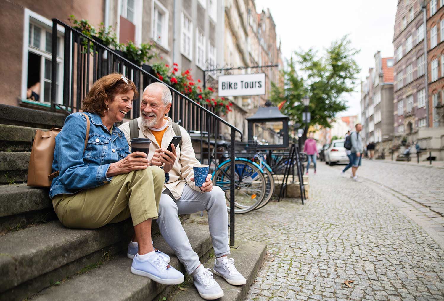 Older couple experiencing difficulty hearing during a conversation, showing signs of hearing loss and frustration