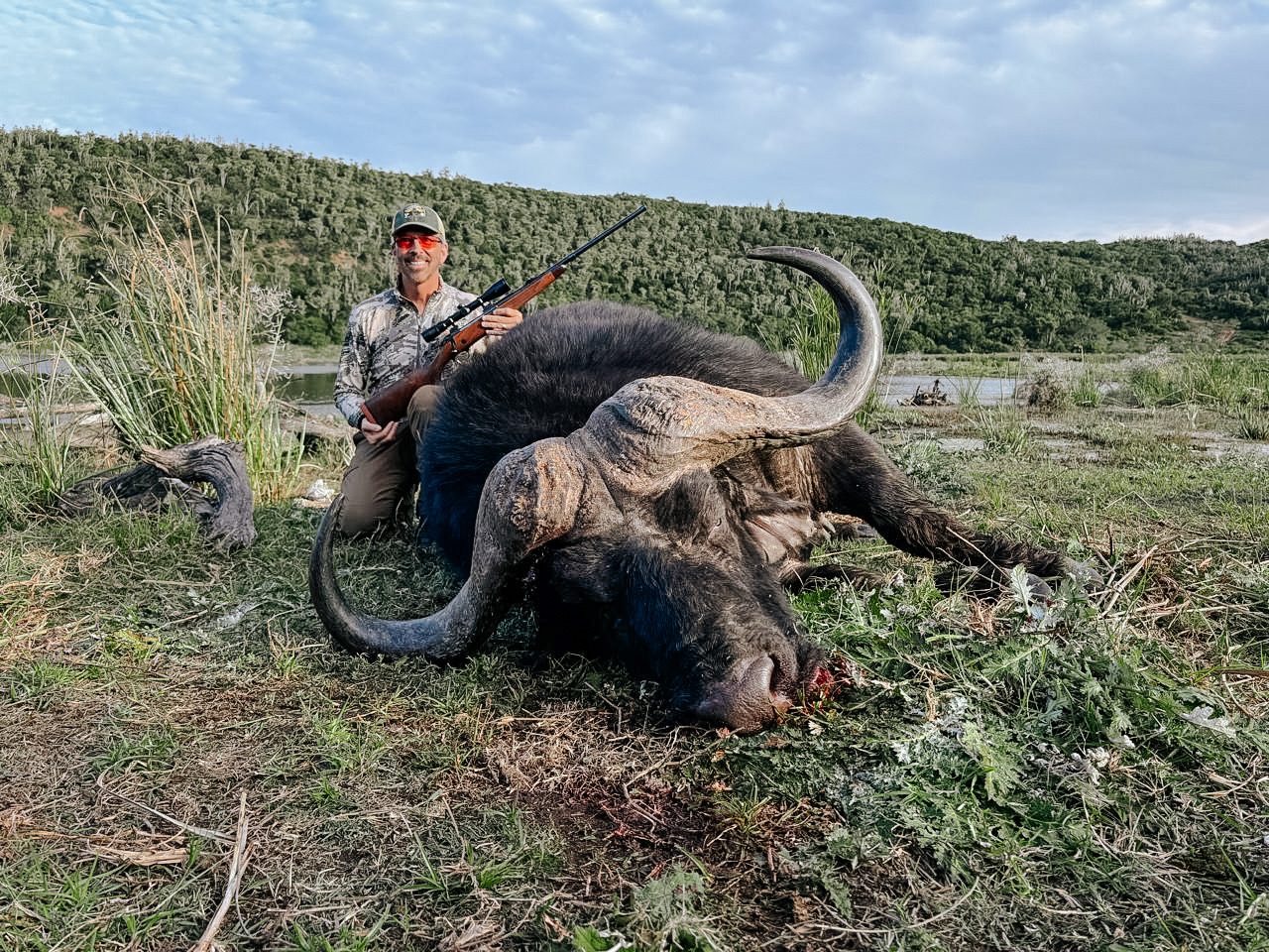 Hunter with a Cape buffalo trophy at Lindale